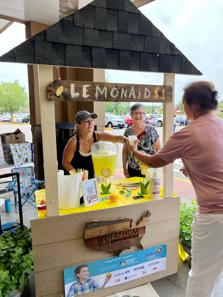 Fathom Realty Agents serving Lemonade to raise charity funds